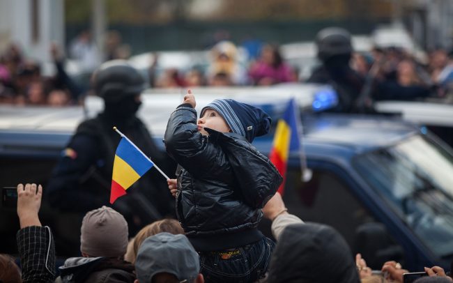 A child is looking up during Romania's National Day festivity that took place in Galați, Romania on December 1st, 2012.