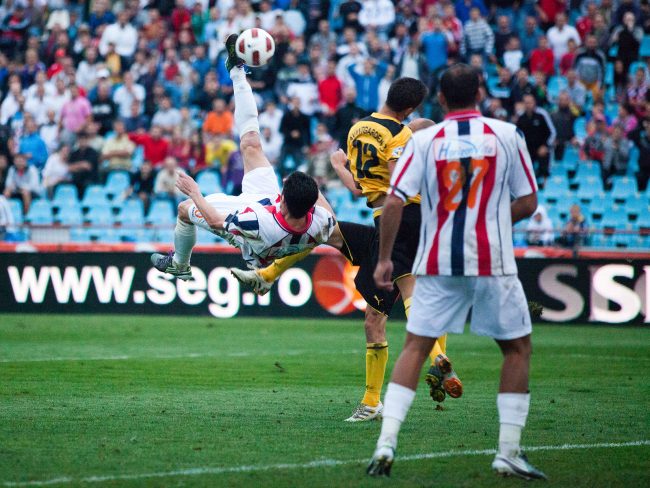 Football players are fighting for the ball in a game played in Galați, Romania on August 29th, 2010.