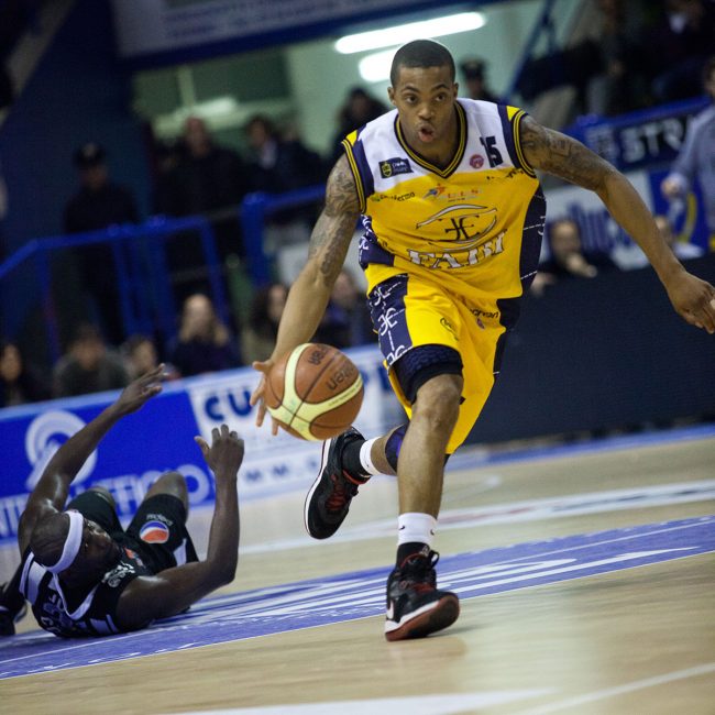 Two basketball players are fighting for the ball in a match between Pepsi Caserta (IT) and Sutor Montegranaro (IT) in Porto San Giorgio, Italy on December 18th, 2010.