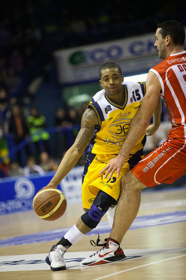 Two basketball players are fighting for the ball in a match between Banca Tercas Teramo (IT) and Sutor Montegranaro (IT) in Porto San Giorgio, Italy on January 2nd, 2011.