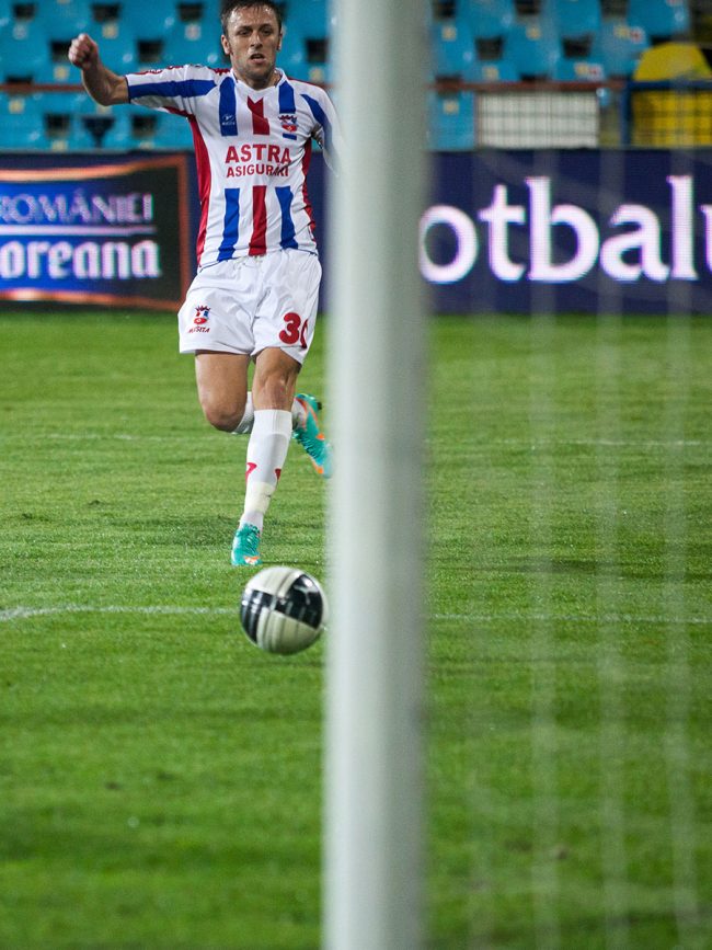 A football player is heading towards the ball in a game played in Galați, Romania on November 1st, 2012