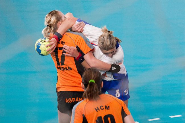 Handball players are fighting for the ball in a game played in Galati, Romania on January 11th, 2009.