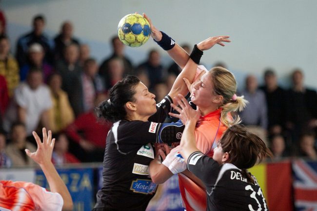 Handball players are fighting for the ball in a game played in Galati, Romania on January 30th, 2009.