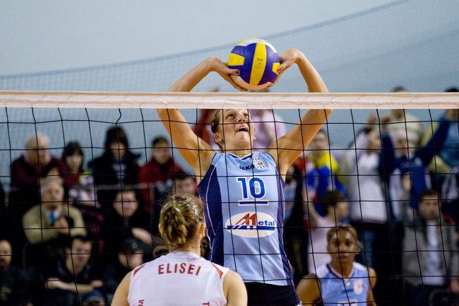 Voleyball players are fighting over the ball in a game played in Galați, Romania on May 9th, 2008.