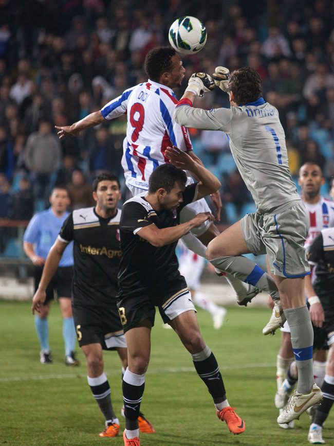 Football players are fighting for the ball in a game played in Galați, Romania on October 20th, 2012.