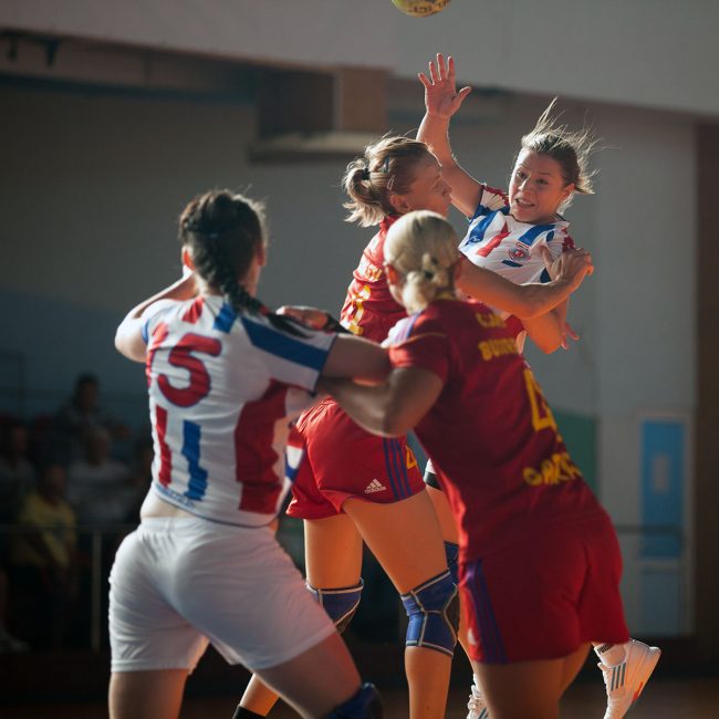 Handball players are fighting for the ball in a game played in Galati, Romania on September 6th, 2012.