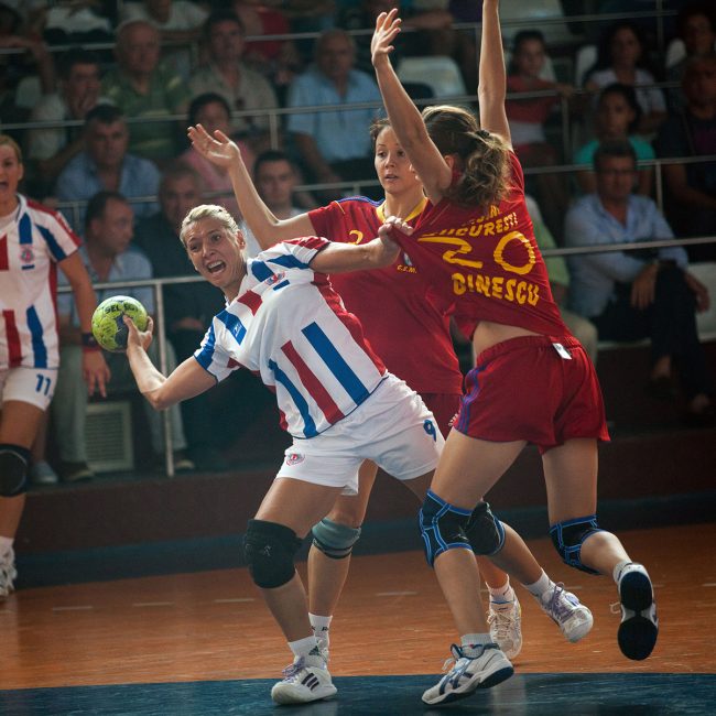 Handball players are fighting for the ball in a game played in Galati, Romania on September 6th, 2012.