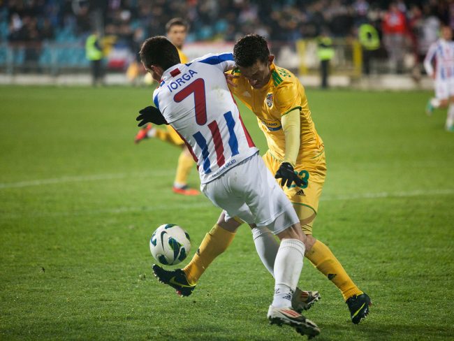 Football players are fighting for the ball in a game played in Galați, Romania on November 19th, 2012.