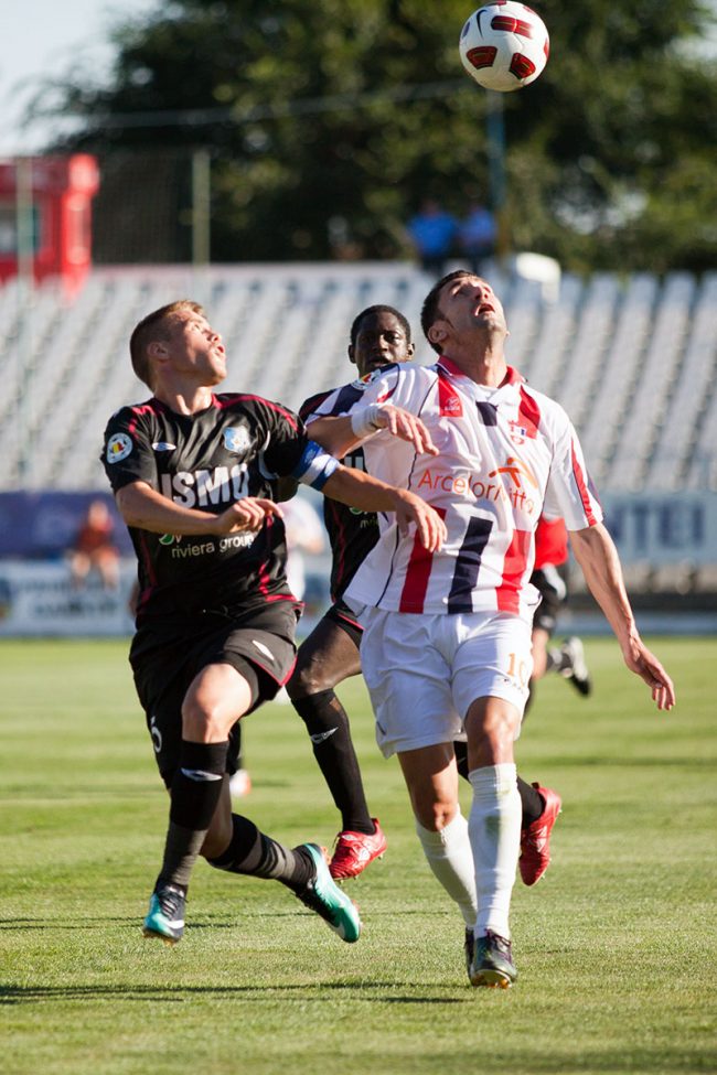 Football players are fighting for the ball in a game played in Galați, Romania on May 8th, 2013.