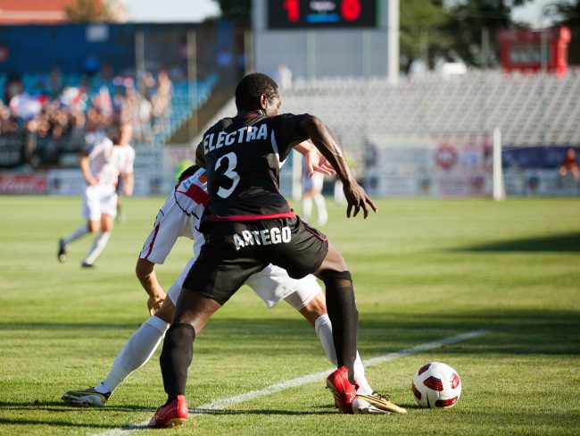 Football players are fighting for the ball in a game played in Galați, Romania on May 8th, 2013.