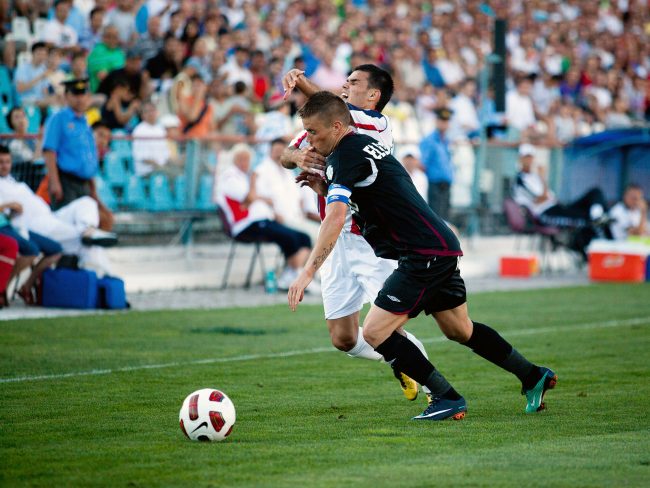 Football players are fighting for the ball in a game played in Galați, Romania on May 8th, 2013.