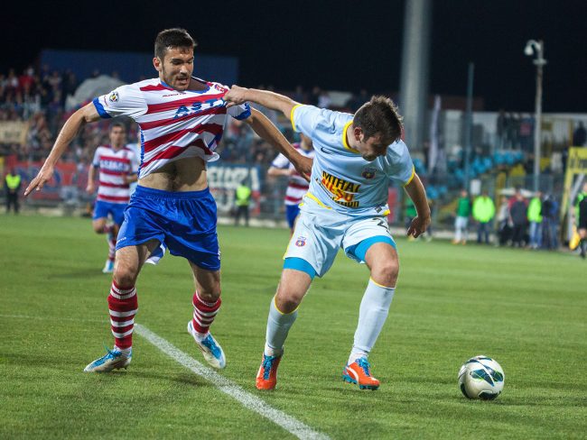 Football players are fighting for the ball in a game played in Galați, Romania on April 1st, 2013.