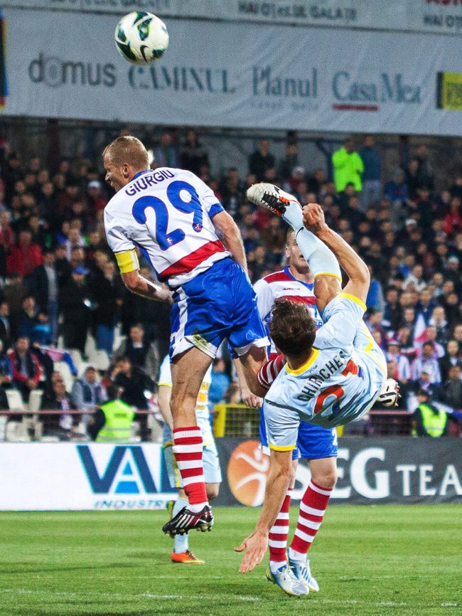 Football players are fighting for the ball in a game played in Galați, Romania on April 1st, 2013.