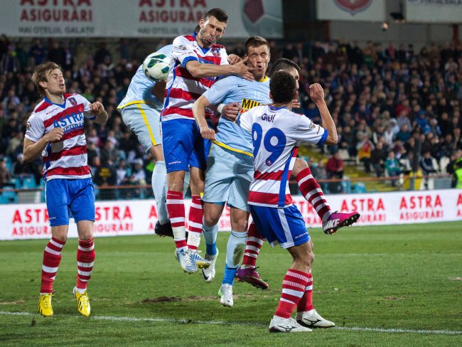 Football players are fighting for the ball in a game played in Galați, Romania on April 1st, 2013.