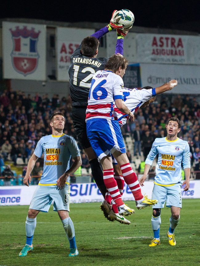 Football players are fighting for the ball in a game played in Galați, Romania on April 1st, 2013.